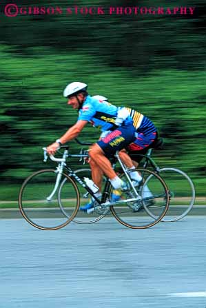 Stock Photo #5862: keywords - action balance bicycle bicycling bike biker blur compete competing competition competitor contest dynamic fall fast helmet human man men motion move movement moving outdoor outdoors peddle power race racers racing recreation ride rider riding risk roll speed sport steer summer transportation vert wheel wheels