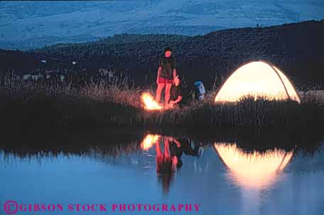 Stock Photo #3543: keywords -  adventure alone alpine backpack calm camp campfire camping couple dusk explore getaway horz husband lake night outdoor people person private recreation reflection released romantic secluded solitude sports summer tent together wife wild wilderness