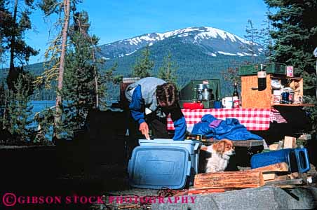 Stock Photo #5900: keywords -  adventure camp camper camping cook cooking diamond equipment explore horz kitchen lake oregon outdoor outdoors outside recreation released sport summer tent travel trip vacation woman