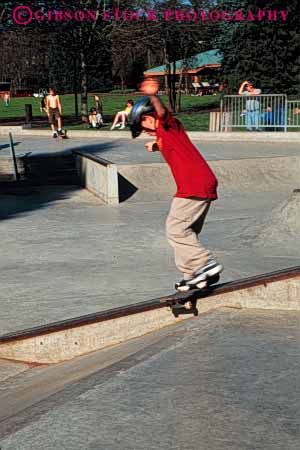 Stock Photo #5905: keywords - board boy california caution child concrete contour fall glide injury outdoor outdoors outside park rail redding ride risk roll skate skateboard skateboarder skateboarding speed steer terrain vert