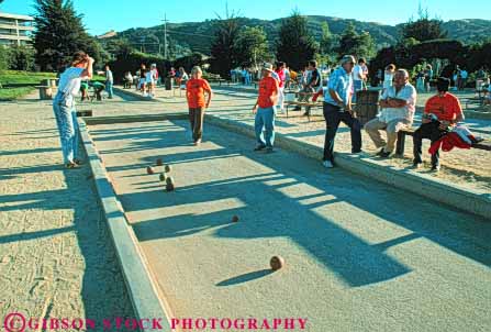 Stock Photo #5956: keywords -  adults alley ball bend boccie count court field game horz measure men mixed outdoor outdoors outside play player players score sport sports team women