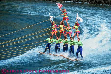 Stock Photo #5958: keywords - aquatic balance boat build ca california careful caution cooperate cooperating cooperation costume costumed diego fall flag flags gender group handle hold horz lake level levels line men mixed outdoor outdoors outside perform performance performers pond practice pull pulled rope san sea show showing ski skier skiers skiing skill slide splash stake steady strength summer swim team teamwork tension three together tow triangle unison unity water wet women world