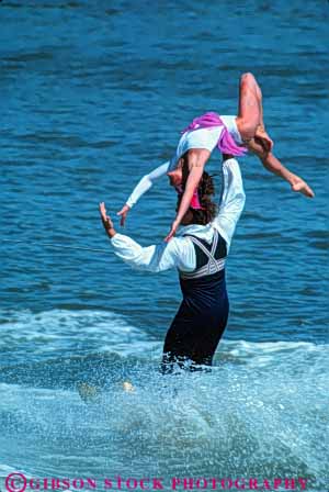 Stock Photo #5961: keywords - aquatic balance boat careful caution cooperate cooperating cooperation costume costumed couple fall gender group handle hold lake line man mixed outdoor outdoors outside perform performance performers pond practice pull pulled rope show showing ski skier skiers skiing skill slide splash steady strength summer swim teamwork tension together tow unison unity vert water wet woman