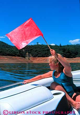 Stock Photo #5963: keywords - action aquatic balance boat communicate communicating communication fall fast flag girl handle hold lake line motion move movement moving outdoor outdoors outside pond practice pull pulled released rope safety signal ski skier skiers skiing skill slide speed splash strength summer swim tension tow use vert warning water wet