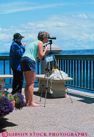 Stock Photo #5978: keywords -  bird birding birds ca california coast coastal count counting identify identifying look monterey naturalist nature ocean outdoor outdoors outside scope sea see spot spotting summer tracking vert vision watching wildlife with woman