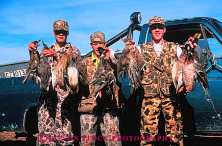 Stock Photo #5981: keywords -  bird birds camouflage duck foul game gun harvest horz hunt hunter hunters hunting kill outdoor outdoors outside recreation rifle shoot sport sports water wildlife