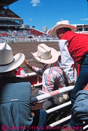 Stock Photo #5984: keywords -  animal arena bronco buster challenge challenging compete competing competition competitor contest cowboy cowboys endurance endure enduring hang hat hats horse horseback horses injury mammal men recreation ride rider risk rodeo rough sport sports vert west western