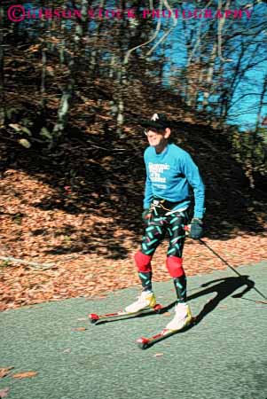 Stock Photo #5989: keywords -  balance elderly exercise exercising glide man mature old outdoor outdoors outside pavement recreation roll roller rollerski rollerskier rollerskiing senior ski skier skiing sport sports street summer vert wheel wheels