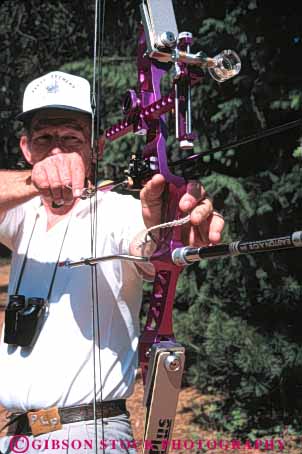 Stock Photo #6194: keywords -  aim aluminum archer archery arrow bow man practice recreation shoot sport sports target vert