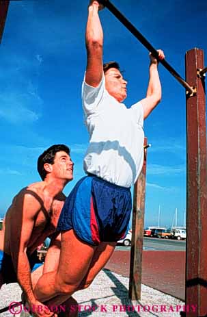 Stock Photo #3457: keywords -  assistance california condition cooperate couple couples exercise francisco help outdoor parcourse pull-up released san share sport strength summer team train vert workout