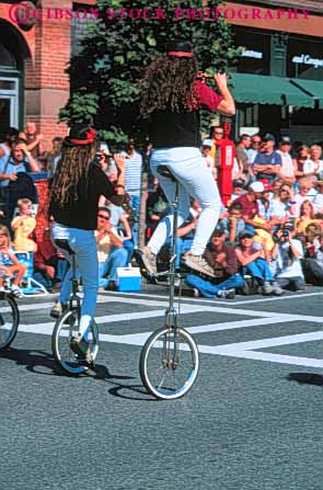 Stock Photo #6205: keywords -  adams balance bicycle display girl girls group in massachusetts north parade peddle perform performance performing ride rider riding roll seat seated show sit unicycle unicycler unicycles unicycling vert wheel