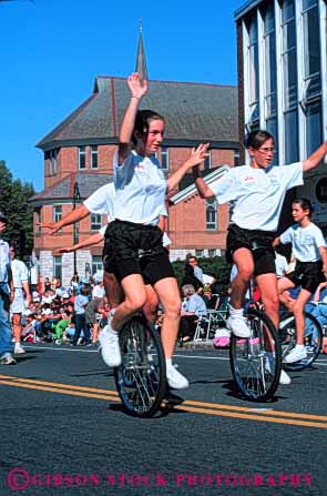 Stock Photo #6206: keywords -  adams balance bicycle display girl girls group in massachusetts north parade peddle perform performance performing ride rider riding roll seat seated show sit unicycle unicycler unicycles unicycling vert wheel