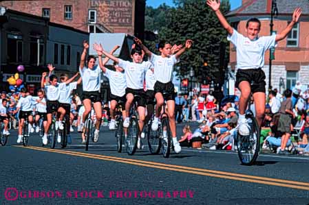 Stock Photo #6207: keywords -  adams balance bicycle display girl girls group horz in massachusetts north parade peddle perform performance performing ride rider riding roll seat seated show sit unicycle unicycler unicycles unicycling wheel