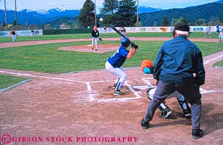 Stock Photo #6216: keywords -  adolescence adolescent adolescents ball base baseball batter catch catcher catching child children cooperate cooperating coordinate coordination diamond field girls home horz look pitch pitcher pitching plate play player playing practice recreation run runner running score see softball sport sports summer team throw thrower throwing umpire uniform watch youth