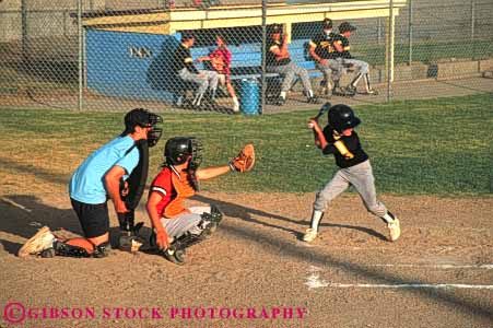 Stock Photo #6218: keywords - adolescence adolescent adolescents ball base baseball bat batter batting catch catcher catching child children cooperate cooperating coordinate coordination diamond field horz pitch pitcher pitching play player playing practice recreation run runner running score sport sports summer team throw thrower throwing uniform youth