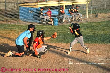 Stock Photo #6218: keywords -  adolescence adolescent adolescents ball base baseball bat batter batting catch catcher catching child children cooperate cooperating coordinate coordination diamond field horz pitch pitcher pitching play player playing practice recreation run runner running score sport sports summer team throw thrower throwing uniform youth