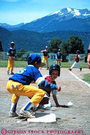 Stock Photo #6219: keywords -  action adolescence adolescent adolescents ball base baseball boy boys catch catcher catching child children cooperate cooperating coordinate coordination diamond field male motion pitch pitcher pitching play player playing practice recreation run runner running runs score slide slides sport sports summer team third throw thrower throwing uniform vert youth