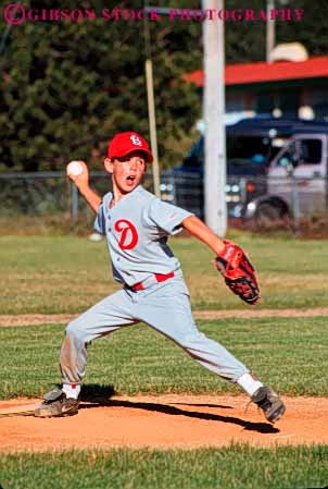 Stock Photo #6222: keywords - action adolescence adolescent adolescents ball base baseball boy catch catcher catching child children cooperate cooperating coordinate coordination diamond field motion pitch pitcher pitching play player playing practice recreation run runner running score sport sports summer team throw thrower throwing uniform vert youth