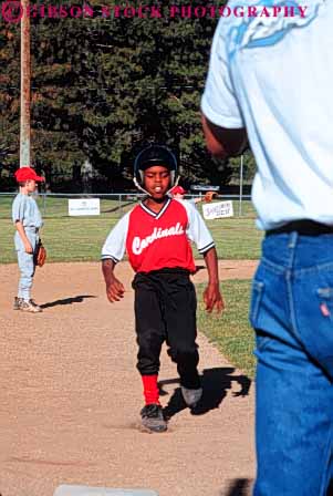 Stock Photo #6223: keywords -  adolescence adolescent adolescents african american ball base baseball black boy catch catcher catching child children cooperate cooperating coordinate coordination diamond ethnic field minority pitch pitcher pitching play player playing practice race recreation run runner running runs score sport sports summer team throw thrower throwing uniform vert youth