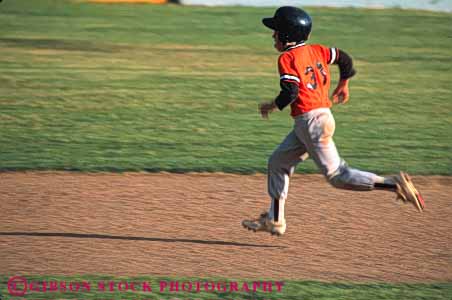 Stock Photo #6224: keywords - action adolescence adolescent adolescents ball base baseball bases boy catch catcher catching child children cooperate cooperating coordinate coordination diamond field horz motion pitch pitcher pitching play player playing practice recreation run runner running runs score sport sports summer team throw thrower throwing uniform youth