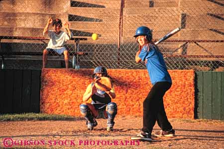 Stock Photo #6227: keywords -  adolescence adolescent adolescents ball base baseball bat batter batting catch catcher catching children chwild cooperate cooperating coordinate coordination diamond field girl horz pitch pitcher pitching play player playing practice recreation run runner running score sport sports summer team throw thrower throwing uniform youth