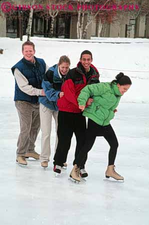 Stock Photo #6230: keywords -  balance cold couple couples ethnic exercise fit fitness four fun glide group hold ice laugh mixed physical physically play recreation released rink skate skater skates skating slide smile sport sports together train vert winter