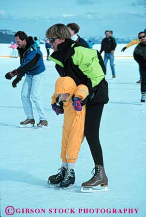 Stock Photo #6240: keywords -  assist balance cold daughter exercise fit fitness fun glide help helps ice learn mother parent physical physically play recreation rink single skate skater skates skating slide sport sports support teach vert winter