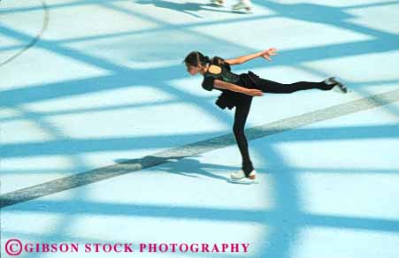 Stock Photo #6244: keywords -  arm arms balance cold colorful delicate exercise figure fit fitness form fun girl glide graceful horz ice physical physically play practice recreation rink routine skate skater skates skating skill slide sport sports winter