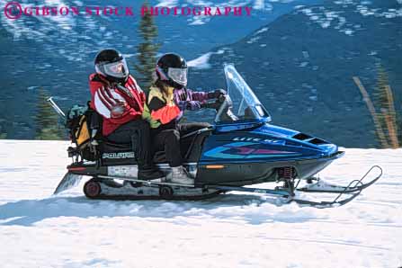 Stock Photo #6255: keywords - action activity cold drive driver driving equipment equipped fiberglass friend friends gear helmet helmets horz loud machines material mobile mobiler mobilers mobiling motion motor motorized move movement moving movving noise outdoor outdoors outfit outfits outside pair passenger people person plastic recreation recreational released ride season share snow snowmobile snowmobiler snowmobilers snowmobiles snowmobiling sport sports steer suit suits synthetic team together transport transportation two vehicle winter woman women