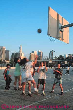 Stock Photo #6266: keywords -  action agile agility angeles backboard ball basket basketball boy boys ca california city cityscape compete competing competition competitor contest cooperate cooperating cooperation downtown dribble dusk effort evening exercise exert exertion fit fitness fun game health high hoop los male man men mens motion move movement moving outdoor outdoors outside pass physical physically play recreation school score shoot shot skill skyline sport sports student summer team teen teenage teenager teenagers teens vert youth