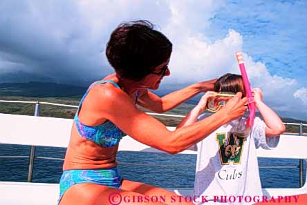 Stock Photo #6274: keywords - active activity adventure assist assistance breath breathing child children coast daughter dive diver divers diving equipment equipped explore fitness fun gear girl girls hawaii help hold horz mask mother ocean parent play recreation released sea single snorkel snorkeler snorkelers sport sports swim swimmer swimmers swimming travel trip tropical tube vacation water with