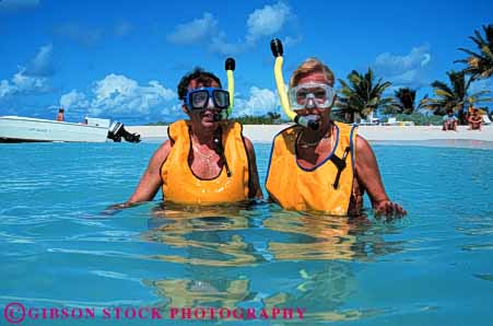 Stock Photo #6278: keywords -  active activity adventure breath breathing coast couple dive diver divers diving elderly equipment equipped explore fitness gear hold horz husband islands man mature ocean old recreation released sea senior share snorkel snorkeler snorkelers snorkeling sport sports swim swimmer swimmers swimming together travel trip tropical tube vacation virgin water wife woman