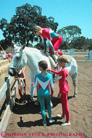 Stock Photo #6284: keywords -  activity adolescence adolescent adolescents animal balance child children equestrian female fun girl girls group hobby horse horseback kid kids mammal outdoor outdoors outside perform performance performing play practice recreation ride rider riders riding share show skill sport sports suit summer team together trained uniform vert youth