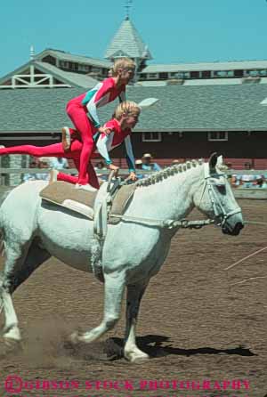 Stock Photo #6286: keywords -  activity adolescence adolescent adolescents animal balance ca california caution child children coordinate coordinated coordination display equestrian fall female friend friends fun girl girls hobby horse horseback injury mammal outdoor outdoors outside pair perform performance performing play practice recreation ride rider riders riding risk share show skill sport sports stanford summer together trained vert