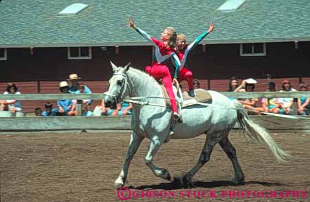 Stock Photo #6288: keywords -  activity adolescence adolescent adolescents animal balance ca california caution child children coordinate coordinated coordination display equestrian fall female friend friends fun girl girls hobby horse horseback horz injury mammal outdoor outdoors outside pair perform performance performing play practice recreation ride rider riders riding risk share show skill sport sports stanford summer together trained