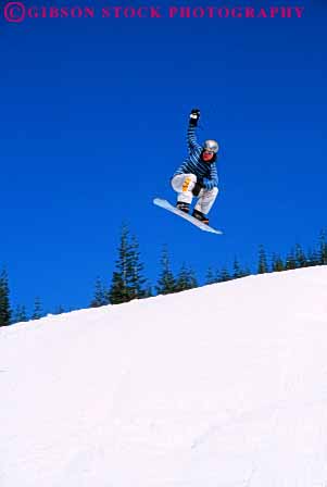 Stock Photo #6296: keywords - airborn aloft board boarder boarding compete competing competition competitor contest danger downhill fall fly flying freestyle girl girls helmet injury jump leap recreation risk snow snowboard snowboarder snowboarding soar sport sports teen teenage teenager teenagers teens thrill vert winter youth