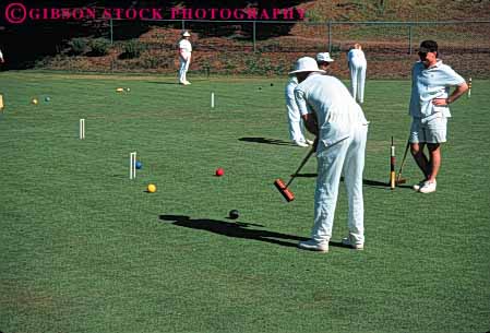 Stock Photo #6310: keywords - aim ball contest court croquet field game grass green hit hoop horz lawn mallet men outdoor outdoors outside pair play practice precise precision recreation roll skill sport summer tap team two uniform white