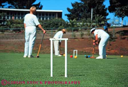 Stock Photo #6311: keywords - aim ball contest court croquet field game grass green hit hoop horz lawn mallet outdoor outdoors outside practice precise precision recreation roll skill sport summer tap uniform white
