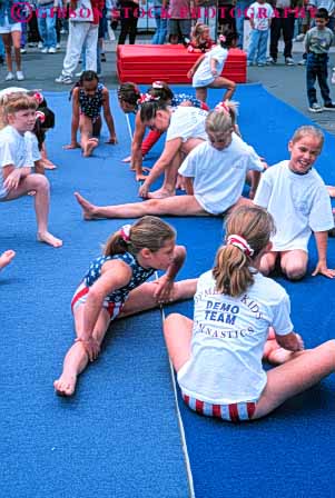 Stock Photo #6325: keywords -  adolescence adolescents aerobic americana athlete athletic child children condition conditioning exercise exercising exert exerting exertion fit fitness flex flexibility flexible flexing girl girls group gymnastics health limber loose loosen loosening mat muscle outdoor outdoors outside physical physically radolescent recreation relax relaxed relaxing sport strength strengthen strengthening stretch stretching summer team tone up vert vitality warm warmup