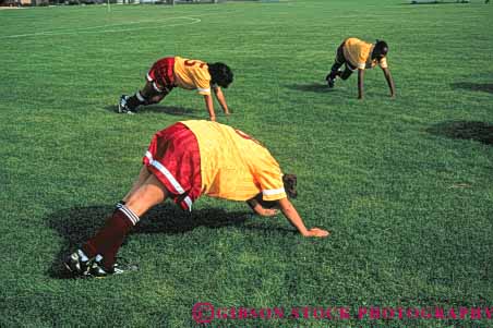 Stock Photo #6330: keywords - aerobic athlete athletic college condition conditioning exercise exercising exert exerting exertion fit fitness flex flexibility flexible flexing health horz limber loose loosen loosening muscle outdoor outdoors outside physical physically players recreation relax relaxed relaxing soccer sport strength strengthen strengthening stretch stretching summer tone up vitality warm warmup women