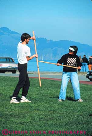 Stock Photo #6331: keywords - akido art class combat contact defense educate education group learn man martial men outdoor outdoors outside practice recreation skill sport stick student summer vert woman women