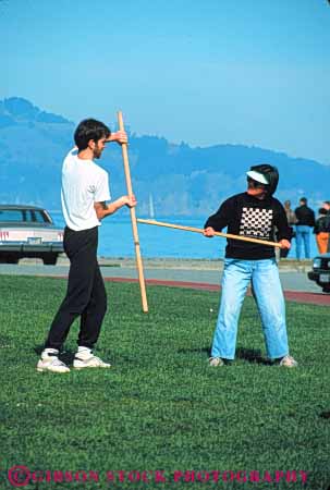 Stock Photo #6331: keywords -  akido art class combat contact defense educate education group learn man martial men outdoor outdoors outside practice recreation skill sport stick student summer vert woman women