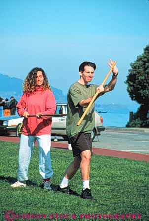 Stock Photo #6332: keywords - akido art class combat contact defense educate education group learn man martial men outdoor outdoors outside practice recreation skill sport stick student summer vert woman women