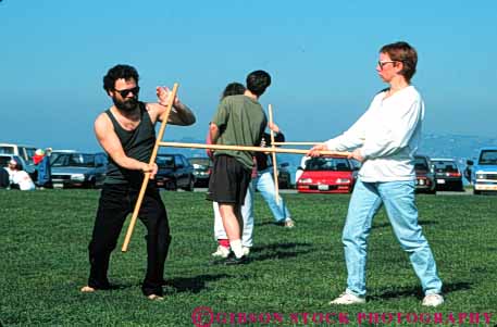 Stock Photo #6333: keywords -  akido art class combat contact defense educate education group horz learn man martial men outdoor outdoors outside practice recreation skill sport stick student summer woman women