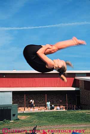 Stock Photo #6340: keywords - adolescence adolescent adolescents child children compete competing competition competitor contest coordination female flip girl girls gymnast gymnastics outdoor perform performance performer performing pike position practice recreation roll rotate rotating rotation skill somersault sport strength vert