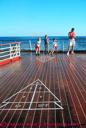 Stock Photo #6352: keywords -  board child children contest cruise deck friction friend friends fun game geometric geometry girl girls group line lines patxtern play practice push recreation released ship shuffle shuffleboard skill slide sport summer team teams travel trip vacation vert