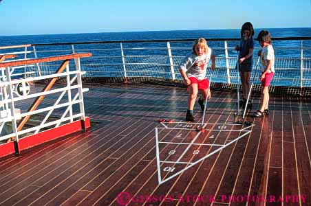Stock Photo #6354: keywords - board child children contest cruise deck friction friend friends fun game geometric geometry girl girls group horz line lines pattern play practice push recreation released ship shuffle shuffleboard skill slide sport summer team teams travel trip vacation
