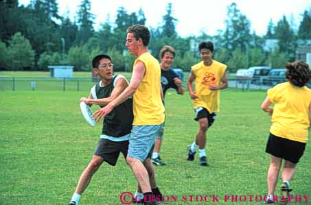 Stock Photo #6358: keywords -  action adult asian block catch college compete competing competition competitor contest disc disk ethnic field fit fitness frisbee fun game group horz man men minority mixed motion move movement outdoor outdoors outside pass passing physical physically play recreation run runners running screen screening spin sport student students team teen teenage teenager teenagers throw together ultimate uniform