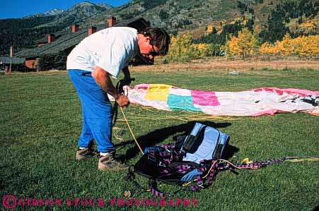 Stock Photo #6361: keywords -  air colorful crash danger dangerous dive drift equipment flight float fly flyer flying glide gravity horz injure injury inspects man parachute paraglide paraglider paragliding pilot recreation resistance risk risky safety sky sport steer suspend suspended