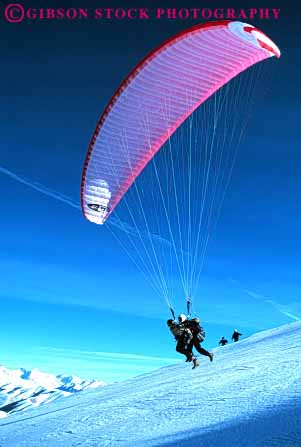 Stock Photo #6362: keywords - air colorful crash danger dangerous dive drift flight float fly flyer flying glide gravity idaho injure injury lift off pair parachute paraglide paraglider paragliders paragliding pilot recreation resistance risk risky safety sky sport steer sun suspend suspended two valley vert winter